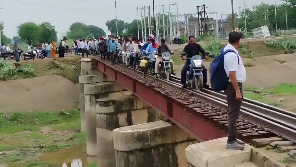 Rain-Damaged Roads in Sheopur Force Commuters to Risk Lives on Railway Tracks Amid Monsoon Chaos